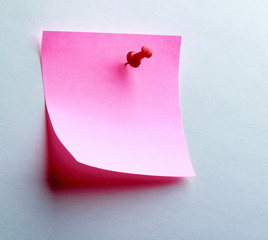 Pink paper note on white background isolated.
