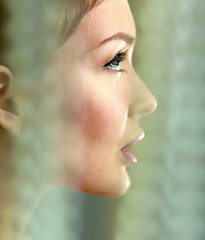 A beautiful woman, portrait isolated on grey background