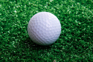 Golf ball ower green grass 