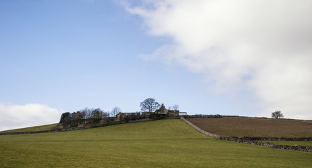 Beautiful sunny landscape of Peak District in UK with famous sto