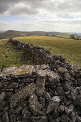 Beautiful sunny landscape of Peak District in UK with famous sto