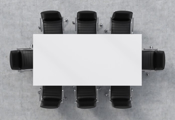 Top view of a conference room. A white rectangular table and eight black leather chairs around. 3D...