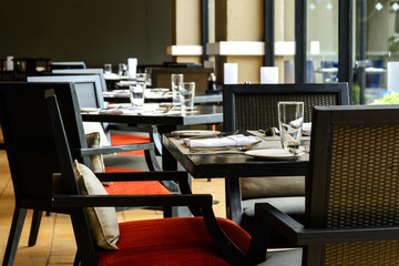 interior of restaurant with black wooden table and chair