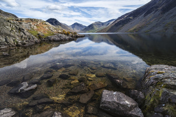 Fototapeta na wymiar Stunning landscape of Wast Water with reflections in calm lake w