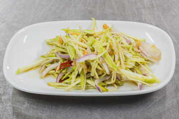 green mango, cucumber, fried taro and green onions. Garnished with parsley and mint. 