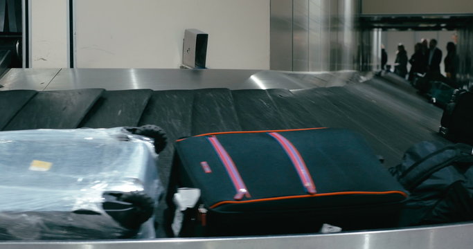 Travel bags on the conveyor belt at airport