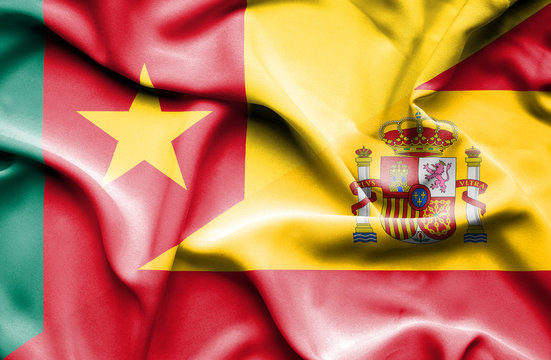 Waving flag of Spain and Cameroon