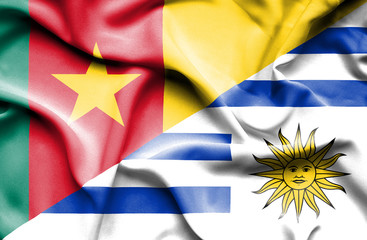 Waving flag of Uruguay and Cameroon