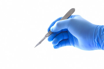 Doctor's hand holding a scalpel with clipping path - obrazy, fototapety, plakaty