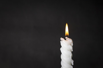 White Candle on Black Wall