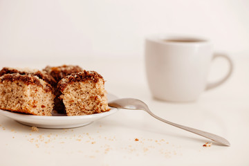 biscuits on white plate with coffee cup on white background