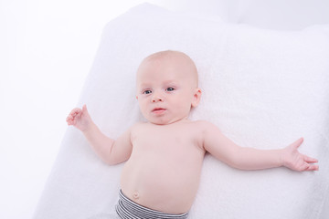 isolated portrait of young happy smiling baby on a white background