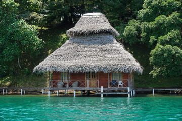 Fototapeta na wymiar Overwater bungalow with thatch roof in Panama
