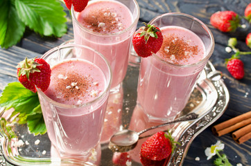 Strawberry smoothie on a wooden table