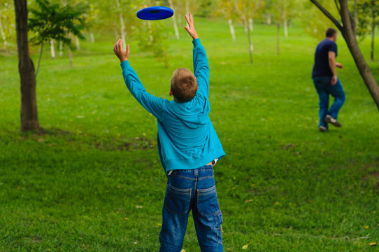 Little boy playing frisbee