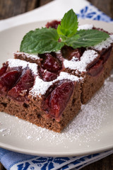 sliced piece of plum cake with cocoa