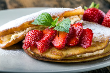 filled with homemade pancakes with strawberries