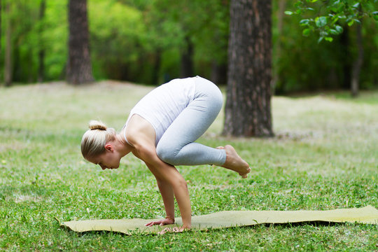 woman doing yoga on the grass