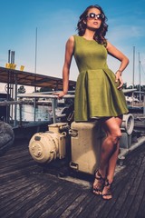 Fototapeta na wymiar Stylish woman on old rusty boat