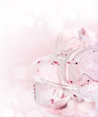 Scoops of ice cream in a glass bowl