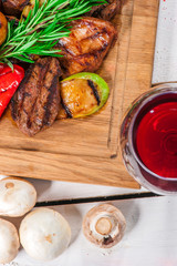 Grilled pieces of meat and different vegetables