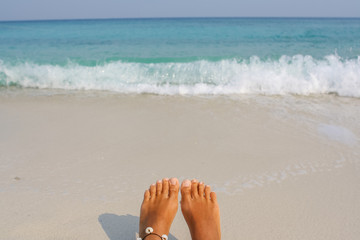 Woman's Bare Feet on the beach.