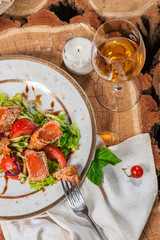 Fresh salad with lettuce and fried salmon