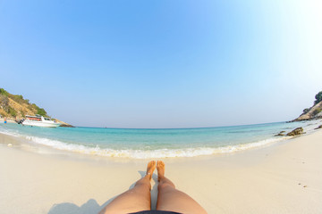 Woman's Bare Feet on the beach.