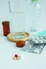 focus Medicine Pills with water glass in background