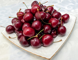 Cherries on white plate