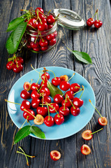 Ripe cherries on a wooden table