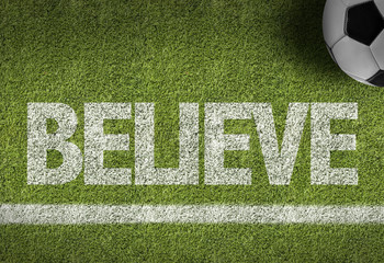 Soccer field with the text: Believe