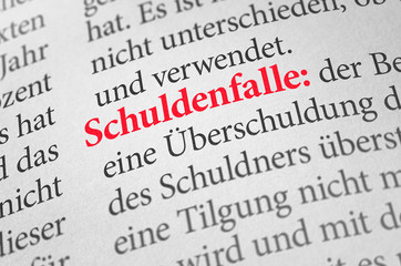Obraz premium Wörterbuch mit dem Begriff Schuldenfalle