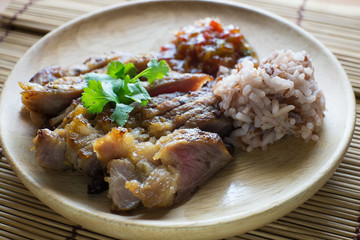 roasted pork on wooden plate