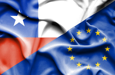 Waving flag of European Union and Chile