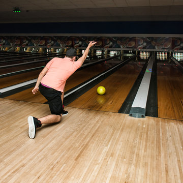 Young Man Play Bowling