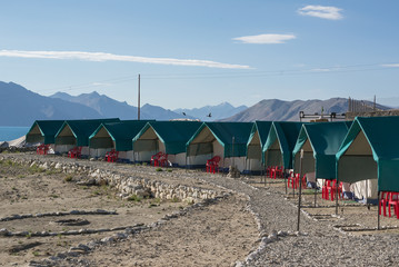 Tented tourist camp at Pangong Lake.Light and shade from sunrise