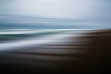 Nostalgic wave streaks across an Oregon shoreline