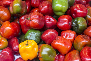 Red, green and yellow chilli pepper from peru called "rocoto" in a market.