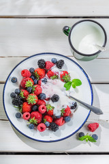 Sweet berry fruits with yogurt