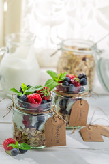 Tasty granola with fruits and yogurt
