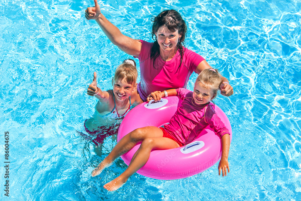 Wall mural family in swimming pool.