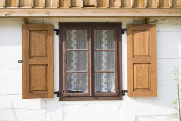 Fototapeta na wymiar Window in old wooden village house