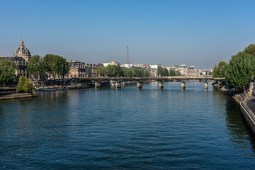 Fototapeta na wymiar Picturesque embankments of Seine River early morning. Paris.