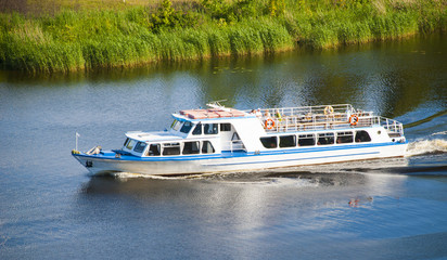 Passenger  boat in tourist business  floating on river  