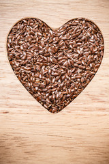 Raw flax seeds linseed heart shaped