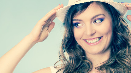 Obraz premium Charming woman in summer straw hat