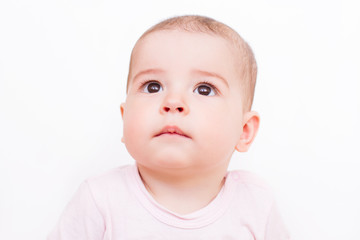 Close-up portrait of a beautiful baby on white background