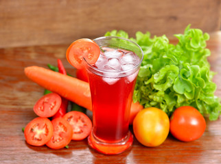 Fresh vegetable juices on wooden table