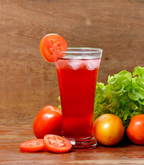 Fresh vegetable juices on wooden table